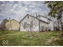 Spacious backyard with green grass and mature trees, perfect for outdoor activities and Gathering gatherings at 5752 Echo Way, Indianapolis, IN 46278
