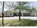 Charming single-story home with a two-car garage and well-maintained driveway at 7014 Eagle Dr, Nineveh, IN 46164