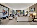 Bright living room showcasing large windows, neutral tones, and sophisticated decor at 7957 Beaumont Green West Dr, Indianapolis, IN 46250