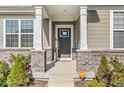 Inviting front entrance featuring brick accents and well-maintained landscaping for added curb appeal at 12894 Corydon Dr, Fishers, IN 46037