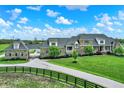 Expansive stone home features a long driveway and lush green lawn at 1581 S 825 E, Zionsville, IN 46077