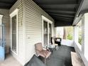 Spacious front porch featuring seating and views of the surrounding neighborhood at 2208 Avondale Pl, Indianapolis, IN 46218