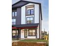 Modern two-story townhouse with white siding, black accents, and a small front yard at 2232 Central Ave, Indianapolis, IN 46205