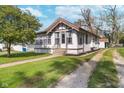 Quaint home with a traditional design, showcasing a well-kept lawn and inviting front entrance at 2735 S Taft Ave, Indianapolis, IN 46241