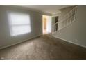 Inviting living room with carpet, natural light and staircase at 3202 Acacia Dr, Indianapolis, IN 46214