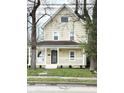 Charming two-story home with a covered front porch and well-maintained landscaping at 3502 N Illinois St, Indianapolis, IN 46208