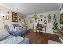 Comfortable living room showcasing hardwood floors, natural light, and a cozy seating area at 409 W Pike St, Martinsville, IN 46151