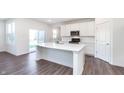 Bright kitchen with a large island, stainless steel appliances and sliding doors at 5804 Summertree Pl, Whitestown, IN 46052