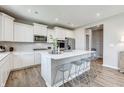Modern kitchen featuring white cabinets, stainless steel appliances, and a spacious center island at 7337 Deerberg Dr, Indianapolis, IN 46259