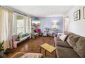 Cozy living room with hardwood floors, lots of light and a comfortable sofa at 7482 N Maple Dr, Frankton, IN 46044