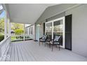 Inviting front porch featuring a cozy seating area, perfect for enjoying the outdoors at 7709 Lewis Rd, Indianapolis, IN 46256