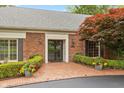 Elegant brick home features a double-door entryway and manicured landscaping at 8535 Washington Blvd, Indianapolis, IN 46240