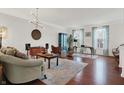 Inviting living room with hardwood floors, stylish decor, comfortable seating and natural light at 967 Orlando St, Carmel, IN 46032