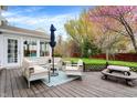 Outdoor patio with stylish seating, an umbrella, and view of the beautiful backyard, perfect for relaxation at 10485 Alderwood Ct, Fishers, IN 46038