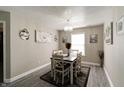 Charming dining room with a modern chandelier, decor, and a window at 10597 Cyrus Dr, Indianapolis, IN 46231