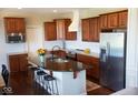 Well-equipped kitchen features a large center island, stainless steel appliances, granite countertops, and ample cabinet space at 1060 Cape Coral Dr, Cicero, IN 46034