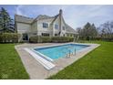 Gorgeous backyard featuring a sparkling in-ground swimming pool at 10628 Walnut Creek W Dr, Carmel, IN 46032