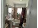 Cozy bathroom with a tub, shower, and pedestal sink at 1150 Younce St, Franklin, IN 46131