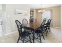 Elegant dining room featuring a dark wood table with seating for six at 11840 Geyser Ct, Fishers, IN 46038