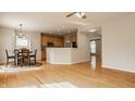 Spacious open floor plan with a kitchen, breakfast nook, and gleaming hardwood floors at 12561 Gladecrest Dr, Carmel, IN 46033