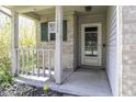 Inviting front porch featuring a charming door and a brick facade, perfect for a cozy welcome at 1328 Osprey Way, Greenwood, IN 46143