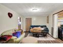 Comfortable living room with hard wood flooring and neutral colored walls at 13346 N Miller Dr, Camby, IN 46113