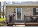 Close up of the home's inviting front porch, featuring stone siding at 1355 E 56Th St, Indianapolis, IN 46220