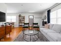 Open-concept living room with a view of the dining area and front door at 1355 E 56Th St, Indianapolis, IN 46220