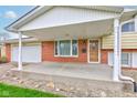 Covered front porch with brick accents, offering a welcoming entrance to the home at 1503 Saint John S Ct, Beech Grove, IN 46107