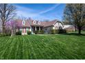 Beautiful single-Gathering home with well-maintained lawn and landscaping, including flowering trees and shrubs at 1770 Valleywood Dr, Avon, IN 46123