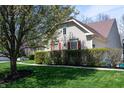 A charming home with lush landscaping and red shutters, offering a cozy curb appeal at 1770 Valleywood Dr, Avon, IN 46123