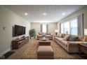 Spacious living room with neutral color palette, plush sofas, and recessed lighting at 2216 Bethel Ave, Indianapolis, IN 46203
