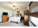 Cozy bedroom with neutral carpet, ceiling fan, and ample natural light from the window at 30 Sleepy Hollow Ct, Westfield, IN 46074