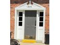 Charming home entrance featuring a decorative door frame and sidelights at 3010 Lake Shore Dr # D, Indianapolis, IN 46205