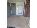 Wide front porch featuring gray siding and brick accents, offering a welcoming entrance at 3097 Limber Pine Dr, Whiteland, IN 46184