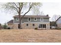 Exterior of home with backyard featuring a large yard and stone and siding exterior at 3316 Eden Way Cir, Carmel, IN 46033