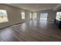 Spacious living room featuring hardwood flooring and lots of natural light at 338 Mcnair Dr, Whiteland, IN 46184