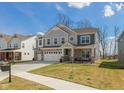 Charming two-story home featuring a well-manicured lawn and welcoming front porch at 4333 Ironclad Dr, Bargersville, IN 46106