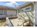 A rear wooden deck with built-in seating offers a space to relax in a tranquil outdoor environment at 525 S Keystone Ave, Indianapolis, IN 46203