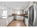 Bright kitchen with granite countertops, stainless appliances, and a farm sink at 5802 Crittenden Ave, Indianapolis, IN 46220
