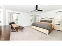 Tranquil bedroom with plush carpeting, neutral tones, and a ceiling fan with abundant light at 605 Tuscany Trl, Lapel, IN 46051