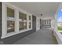 Inviting front porch, complete with a porch swing, is perfect for relaxing and enjoying the outdoors at 67 S 9Th Ave, Beech Grove, IN 46107