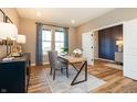 Cozy home office with a modern desk, stylish decor, and wood-look floors at 7076 Portico Ln, McCordsville, IN 46055
