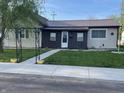 Charming home with well-maintained lawn, metal roof, and inviting walkway at 760 E Walnut St, Martinsville, IN 46151