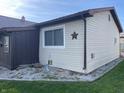 View of home's side exterior showcasing clean siding and tidy space at 760 E Walnut St, Martinsville, IN 46151