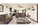 Inviting living room featuring neutral carpet, ceiling fan, and comfortable furnishings, creating a cozy atmosphere at 8327 S County Road 825 E, Plainfield, IN 46168