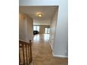 Inviting entryway with hardwood floors leading to a bright and open living area at 8859 Delaney Dr, Fishers, IN 46038