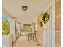Inviting covered front porch with room to relax and enjoy the outdoors at 936 N Oxford St, Indianapolis, IN 46201