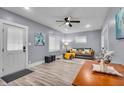 Bright living room with stylish flooring, ceiling fan, and plenty of natural light at 936 N Oxford St, Indianapolis, IN 46201