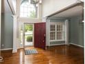 Inviting foyer with hardwood floors, a high ceiling, and a view to the outside at 11648 Stickney Ct, Fishers, IN 46037